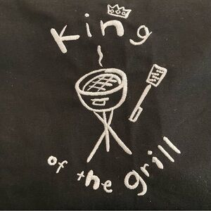 - “KING OF THE GRILL” WENDY TANCOCK TORONTO EMBROIDERED BLACK APRON